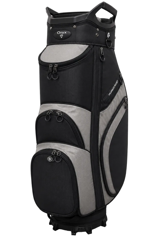 A black and gray OLYX golf cart bag standing upright on a gray carpeted floor against a white wall.